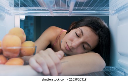 Happy Woman Cooling Herself In The Fridge During The Heatwave, POV Shot From Inside Of The Fridge