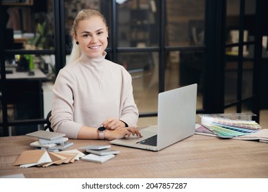 Happy Woman Creative Interior Designer Working At Office Workplace With Laptop.Online Consultation With Client Through Video Call.