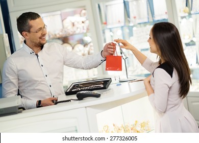 Happy Woman Customer In A Jewellery Shop 