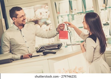 Happy Woman Customer In A Jewellery Shop 