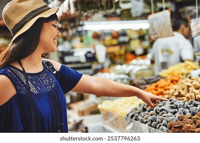 Happy woman, customer or pointing with food for grocery shopping, snack or choice at supermarket. Young, female person or shopper with smile for healthy selection, picking or organic produce at store - Powered by Shutterstock