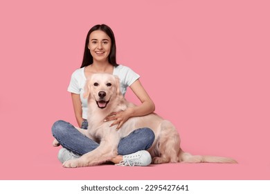 Happy woman with cute Labrador Retriever dog on pink background, space for text. Adorable pet - Powered by Shutterstock