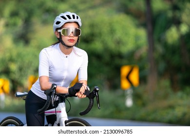 Happy Woman Cycling Athlete Prepare For Ride Bicycle On Street, Road, With High Speed For Exercise Hobby And Competition In Professional Tour