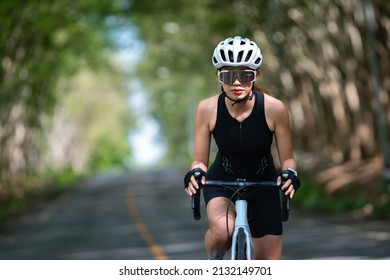 Happy Woman Cycling Athlete Prepare For Ride Bicycle On Street, Road, With High Speed For Exercise Hobby And Competition In Professional Tour