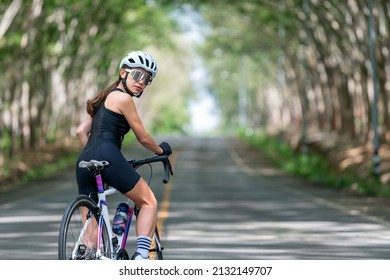 Happy Woman Cycling Athlete Prepare For Ride Bicycle On Street, Road, With High Speed For Exercise Hobby And Competition In Professional Tour