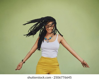 Happy woman, dance and dreadlocks in studio for fashion, stylish clothes and cool look with confidence. Female person, jewelry and trendy accessory with dancer for energy, moving and green background - Powered by Shutterstock