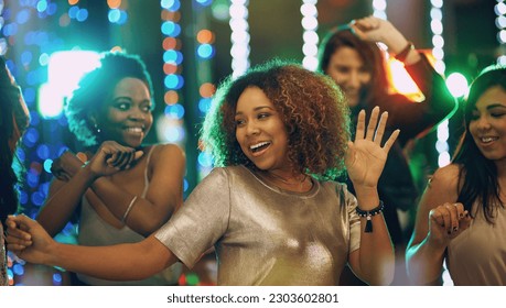 Happy woman, dance and party in nightclub with friends, social event and new year concert. Dancing group, women and disco celebration with music, night life and crowd for energy, smile and happiness - Powered by Shutterstock