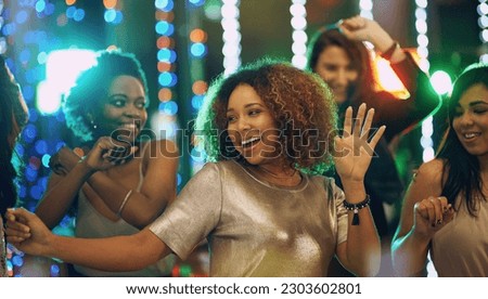 Happy woman, dance and party in nightclub with friends, social event and new year concert. Dancing group, women and disco celebration with music, night life and crowd for energy, smile and happiness 商業照片 © 