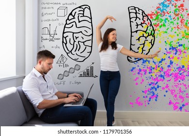 Happy Woman Dancing Near Her Busy Husband Working On Laptop At Home