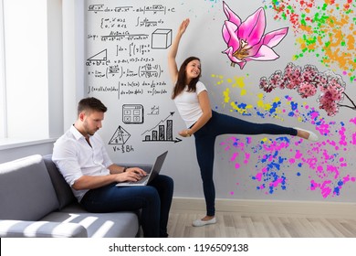 Happy Woman Dancing Near Her Busy Husband Working On Laptop At Home