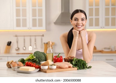 Happy Woman With Different Products In Kitchen. Keto Diet