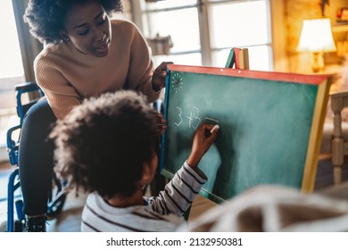 Happy Woman With Disability Learning Together With A Child. People Education Fun Concept