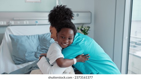 Happy woman, doctor and child hug for teddy bear, healthcare or support on hospital bed. Female person, nurse or medical assistant hugging little boy smile with soft toy at clinic for checkup or care - Powered by Shutterstock