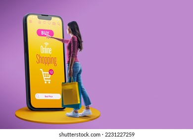 Happy woman doing online shopping using a big smartphone, she is holding shopping bags and touching the buy button on the screen