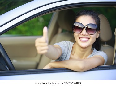 Happy Woman Driver In Her New Car