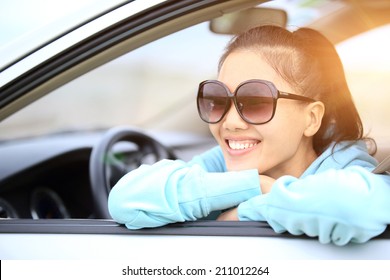 Happy Woman Driver In Her New Car 