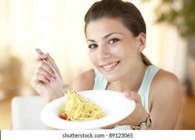 Happy Woman Eating Pasta