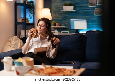 Happy Woman Eating Tasty Delicious Delivery Burger Relaxing On Sofa Watching Comedy Movie On Television In Living Room. Takeout Food, Eating Home, Home Delivery, Burger Delivery, Beer Bottle, Caucasia