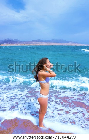 Happy woman enjoying beach relaxing