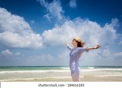 Happy Woman Enjoying At The Beach. Summer Vacations Concept