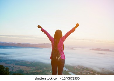 Happy Woman Enjoying Open Hands-on Mountain Reborn To Worship Praise God For Wellbeing Up In Vision Freedom And Hope.
