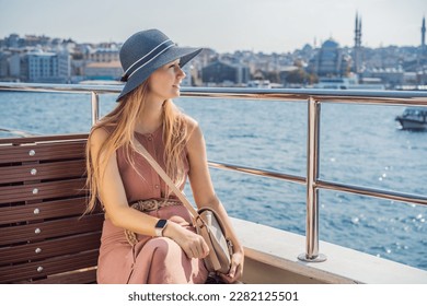 Happy woman enjoying the sea from ferry boat crossing Bosphorus in Istanbul. Summer trip to Istanbul - Powered by Shutterstock