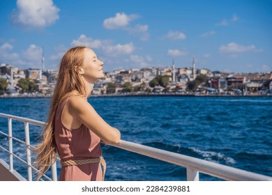 Happy woman enjoying the sea from ferry boat crossing Bosphorus in Istanbul. Summer trip to Istanbul - Powered by Shutterstock