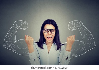 Happy Woman Exults Pumping Fists Celebrates Success On Gray Wall Background 
