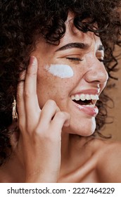 Happy woman, face cream and beauty, makeup product and sunscreen facial treatment for aesthetic shine. Young model, face freckles and body lotion, cosmetics and healthy skincare, wellness and melasma - Shutterstock ID 2227464229