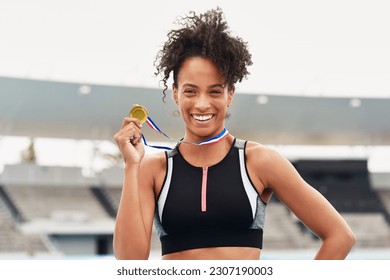 Happy woman, fitness and portrait smile with gold medal for winning, athletics or running competition at stadium. Fit and active African female person, runner or winner smiling with award in victory - Powered by Shutterstock