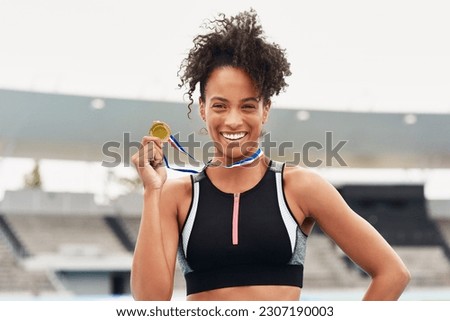 Happy woman, fitness and portrait smile with gold medal for winning, athletics or running competition at stadium. Fit and active African female person, runner or winner smiling with award in victory