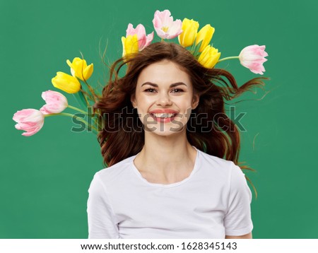 Happy woman with flowers behind spring head