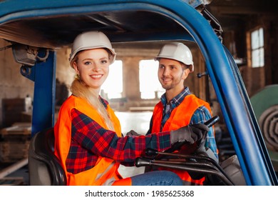 Happy Woman Forklift Driver Smiling, Looking At The Camera