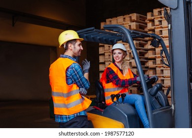 Happy Woman Forklift Driver Smiling, Looking At The Camera