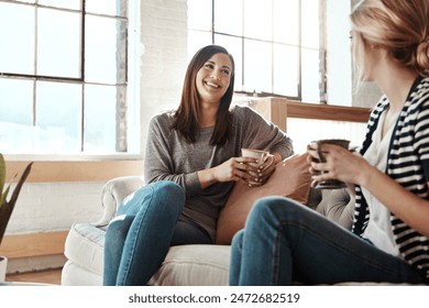 Happy woman, friends and laughing with coffee on sofa for funny joke, social or discussion in living room at home. Female person with smile for morning, drink or conversation for catch up at house - Powered by Shutterstock