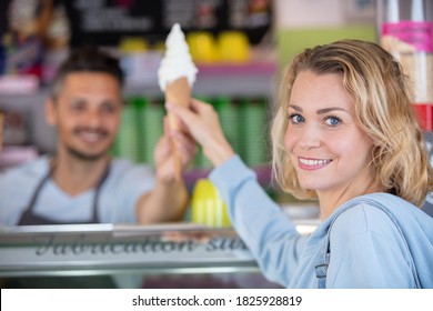 happy woman getting her ice cream