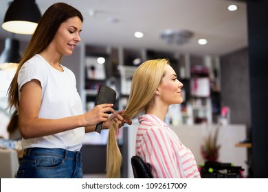 Happy woman at the hair salon - Powered by Shutterstock