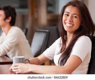 Happy woman having a coffee in a cafe - Shutterstock ID 84632809