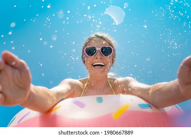 Happy woman having fun on summer vacation outdoor against blue sky background. Spring break!