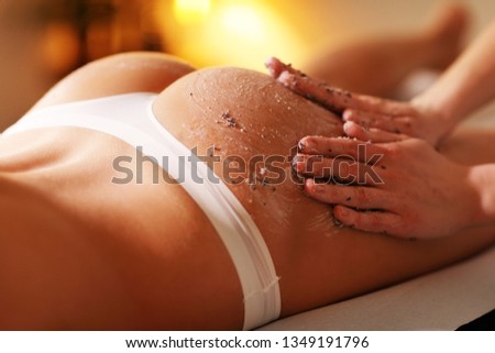 Happy woman having peeling in spa salon