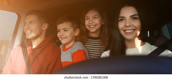 Happy Woman With Her Family Inside Modern Car On Sunny Day. Banner Design