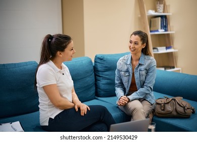 Happy Woman And Her Physical Therapist Talking After The Treatment.