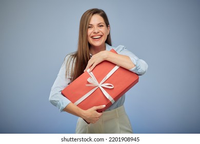 Happy woman holding big red gift box for present. Isolated female portrait.