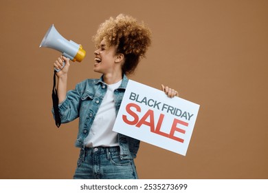 Happy woman holding Black Friday sale poster while shouting through megaphone. Copy space. - Powered by Shutterstock