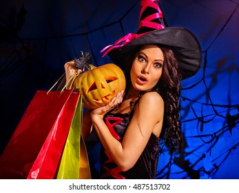 Happy Woman Holding Halloween Shopping Bag. Halloween Shopping.