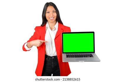 Happy Woman Holding A Laptop With Green Screen Pointing It. Chroma Key Laptop Screen. Smiling Looking At Camera. Isolated On White Background. Young Asiatic Woman.