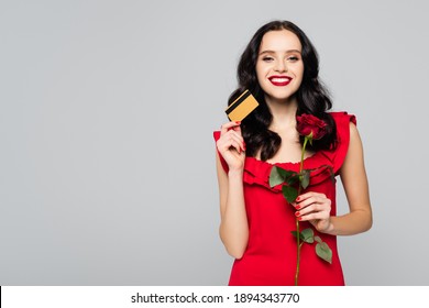 happy woman holding red rose and credit card isolated on grey - Powered by Shutterstock