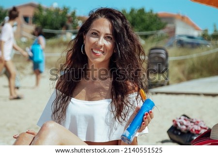 Similar – Brunette surfer woman with top and bikini holding surfboard