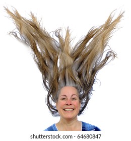 Happy Woman With A Huge Grin Showing Her Teeth With Her Brown Hair Up In The Air