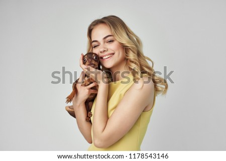 happy woman hugging pet                               